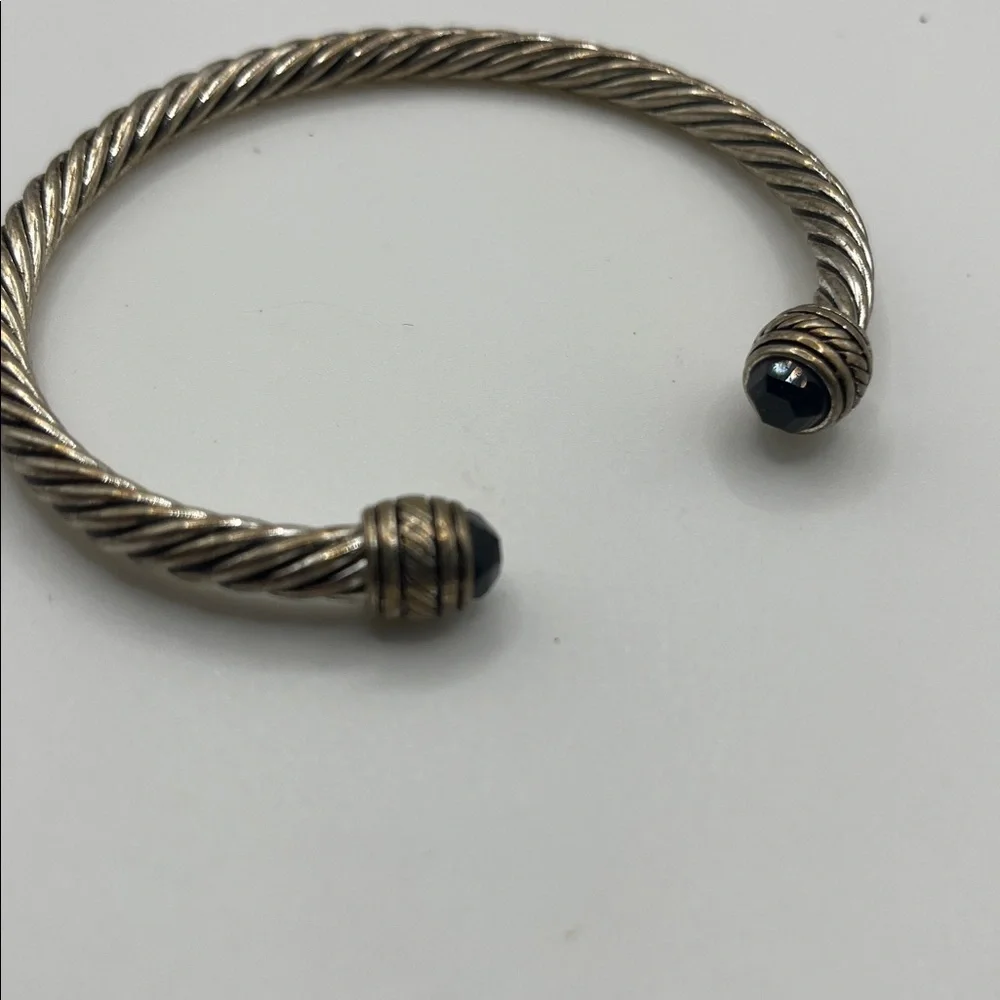 TWISTED CUFF BRACELET WITH MULTIFACETED BLACK GLASS BEADED ENDS